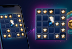 A high-tech digital casino interface with a smartphone displaying a Mines game alongside a detailed winning grid and an 18.5x multiplier.